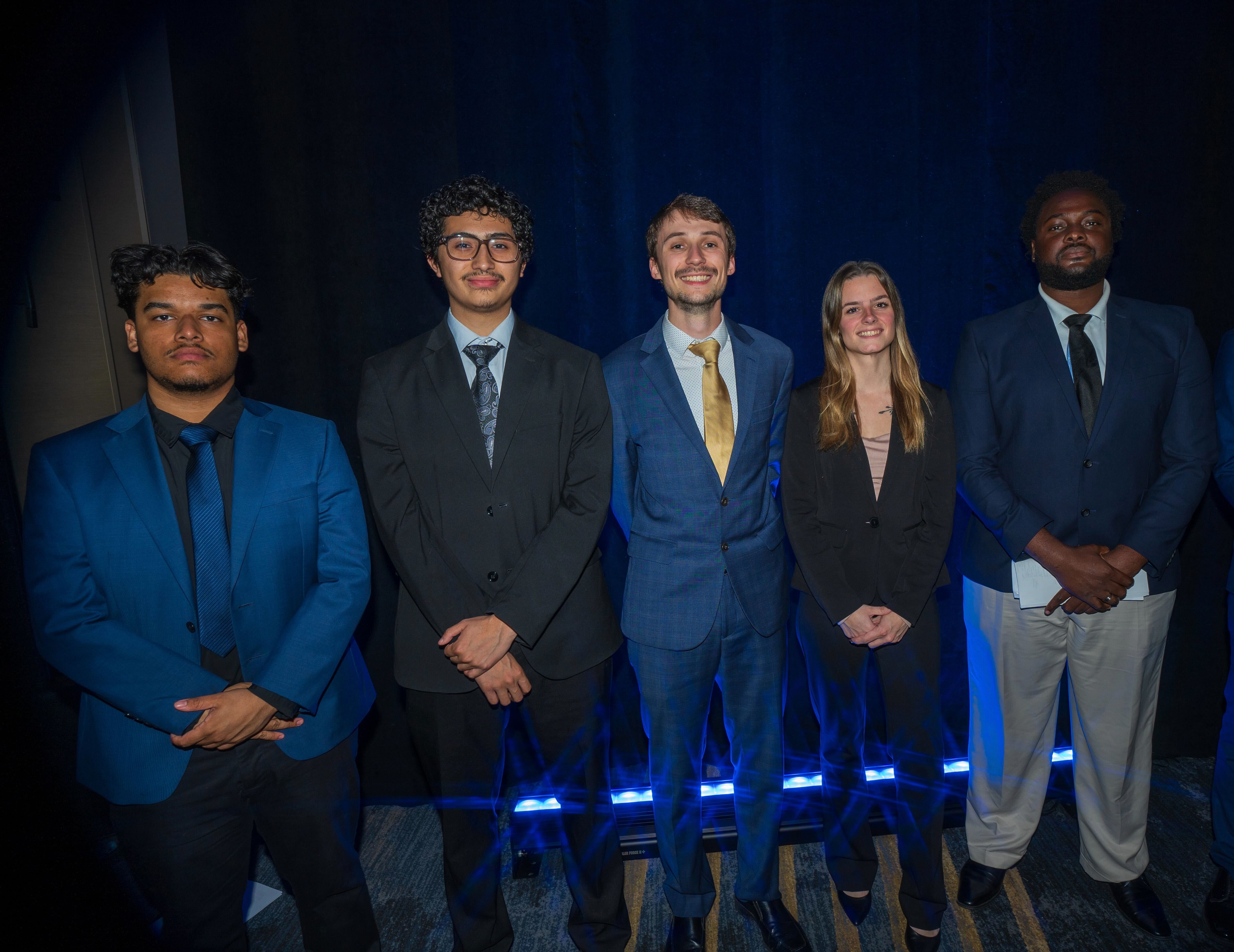 Miller Cole Solutions team posing at a professional event